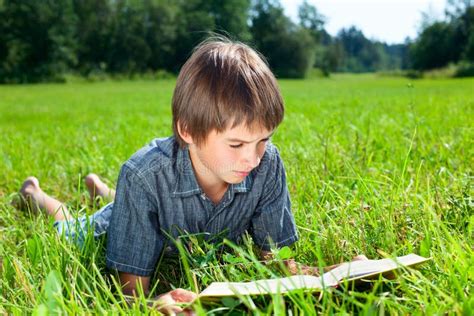 Child reading book outdoor stock photo. Image of education - 44869674