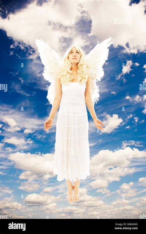 Angel floating in the sky Stock Photo - Alamy