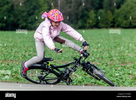 Child fall bike accident ride helmet, fall off bike Stock Photo - Alamy