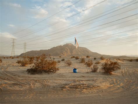 Photos show border walls dividing the U.S. and Mexico