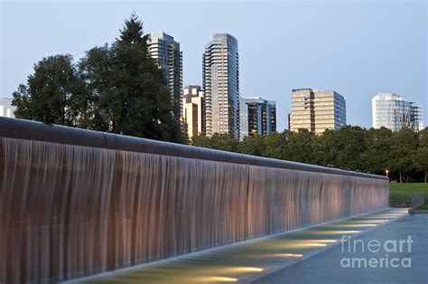 Bellevue skyline from city park with fountain and waterfall at s ...