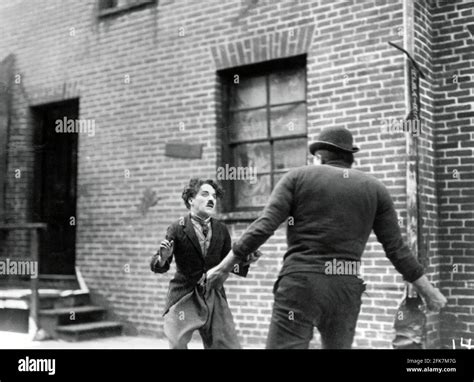 CHARLES REISNER and CHARLIE CHAPLIN in THE KID (1921), directed by ...