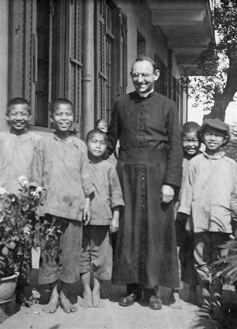 Figure 1.--This photograph was taken in Hong Kong during 1926. We see a Catholic priest with his ...