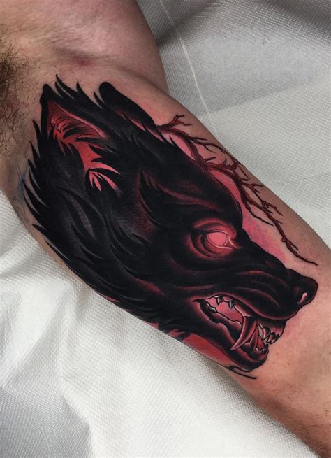 Wolfs Upper Arm Tattoo | Wolf tattoos, Hand tattoos for guys, Body art tattoos