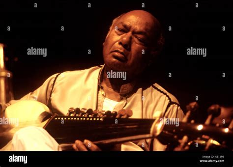 Indian classical musicians Ustad Ali Akbar Khan playing Sarod Stock ...