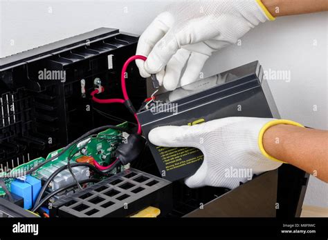 Technician replacing the UPS(Uninterruptible Power Supply) battery Stock Photo - Alamy