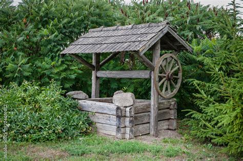 Old water well with pulley. Wooden water well in village. Lithuania ...