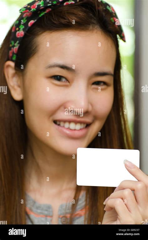 Cute girl holding credit card Stock Photo - Alamy