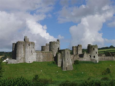 View of Kidwelly Castle showing nearby buildings, oblique aerial view. 5”x4” black and white ...