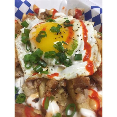 Never take life seriously. — Sisig Fries w/ Egg. #BlueSaigon #SisigFries...