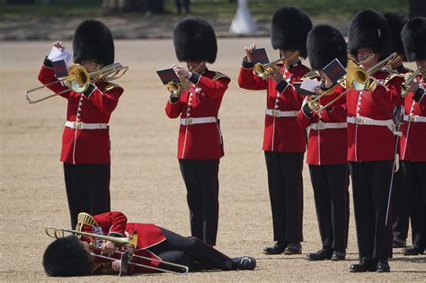 Several British royal guards faint due to heat during ceremony with ...