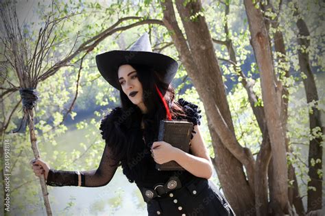 witch costume with broom Stock Photo | Adobe Stock