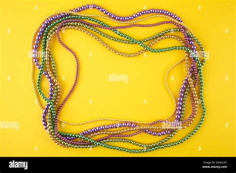 Mardi Gras beads background with place for text Stock Photo - Alamy