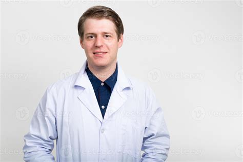 Doctor smiling 942045 Stock Photo at Vecteezy