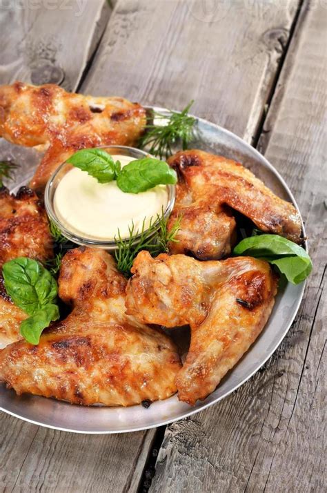 Fried chicken wings with sauce 759765 Stock Photo at Vecteezy