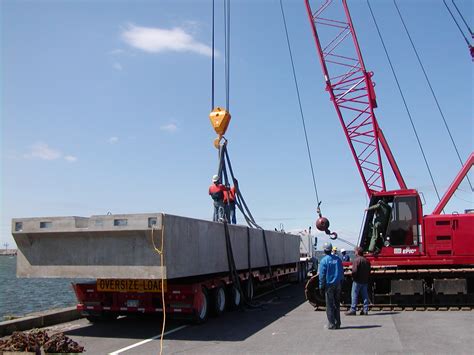 Port of Oswego Marina: First sections of the new Wave Attenuator arrive at International Marina West