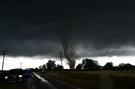 Freak mini-tornado caught on camera spinning away in SCOTLAND as stunned camerawoman looks on ...