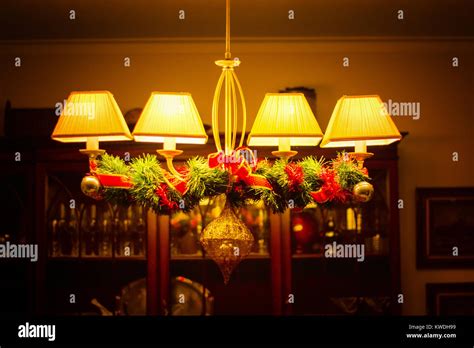Christmas dining table with candles and plant Stock Photo - Alamy