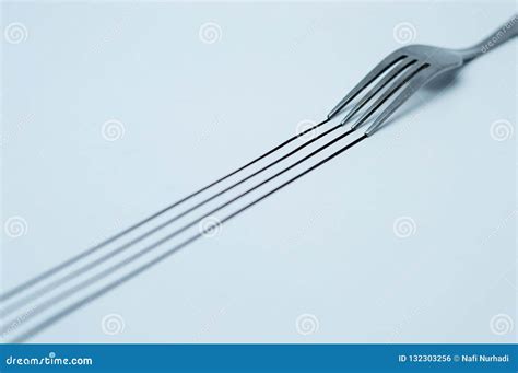 A Black Trail from a Fork on White Papers Stock Photo - Image of ...