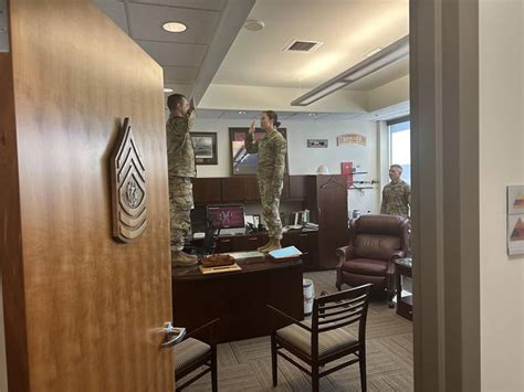 Soldier reenlists while standing on division sergeant major’s desk