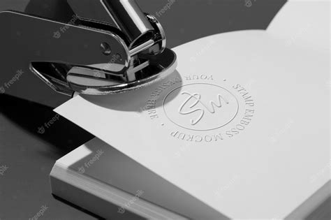 Premium PSD | Metallic stamp with embossed logo effect on paper