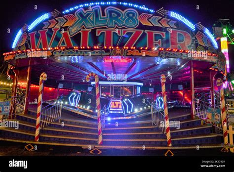 Waltzer Funfair Ride At Night With Bright Flashing Lights - Fast Fair ...