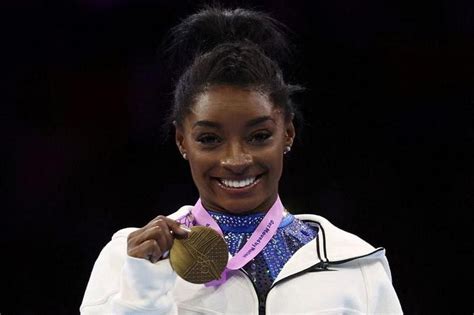 Simone Biles wins 21st world gymnastics championship title with all-around gold; with more to ...