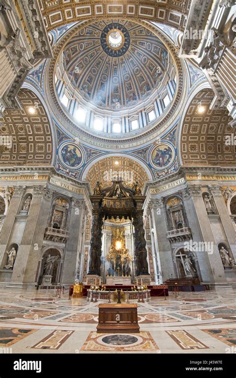 An wide angle interior view inside St Peter's Basilica of the main alter and dome Stock Photo ...