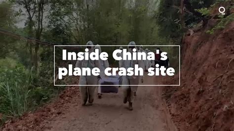 Watch Inside China's Plane Crash Site - Bloomberg