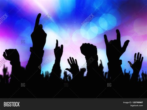 Silhouettes of concert crowd hands supporting band performing live ... | Hand silhouette ...