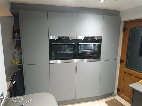 Matt grey kitchen. Oven, combination microwave, Warming drawer, fridge ...