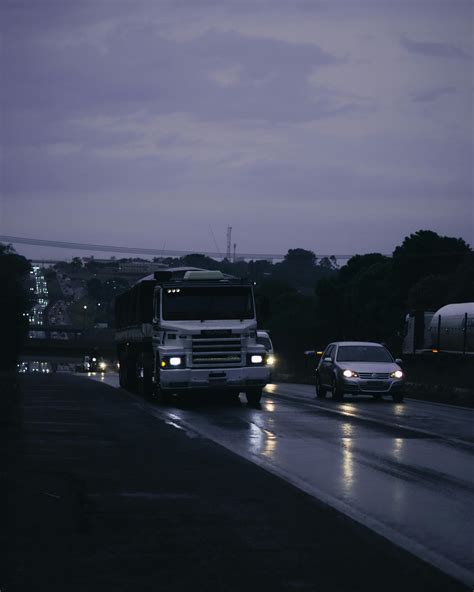 Cars Parked on Parking Lot during Night Time · Free Stock Photo