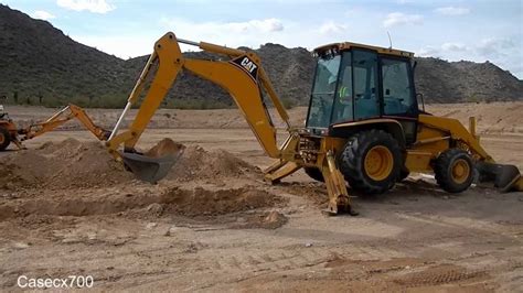 Digging a Trench with a CAT 420D Backhoe - YouTube