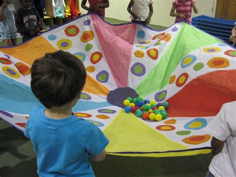 Parachute play in preschool | Parachute games, Preschool, Preschool games