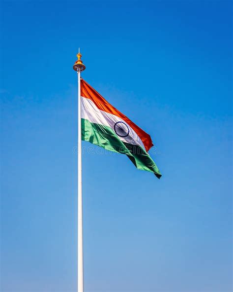 Indian National Flag , Flying High in the Sky on a Clear Blue Background. Stock Photo - Image of ...