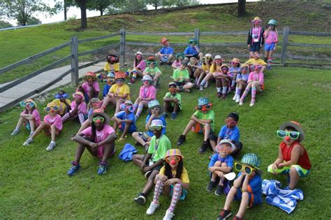 Royal Family Kids Camp campers sitting on hill - Birmingham Christian ...