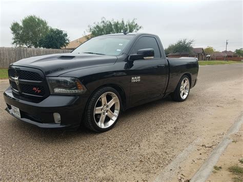 Black Truck Parked on Side of Road