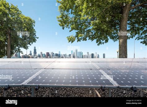 solar energy panels with city Stock Photo - Alamy