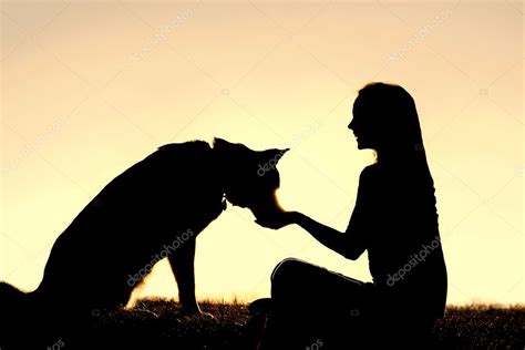 Woman Feeding Pet Dog Treats Silhouette — Stock Photo © Christin_Lola ...