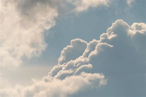 Premium Photo | White fluffy clouds background