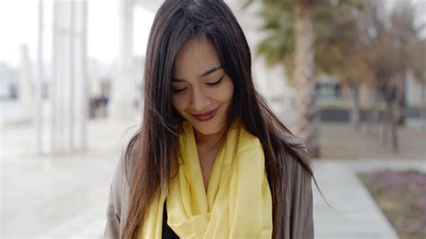 Joyful Grinning Woman Outside In Yellow Scarf Stock Footage SBV-305229919 - Storyblocks