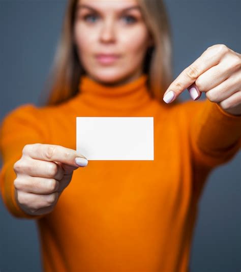 Premium Photo | Businesswoman holds blank business card