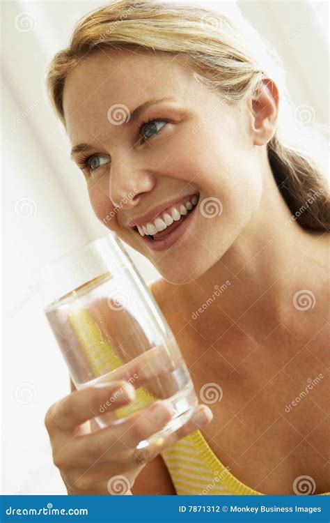 Young Woman Drinking a Glass of Water Stock Photo - Image of holding, vertical: 7871312