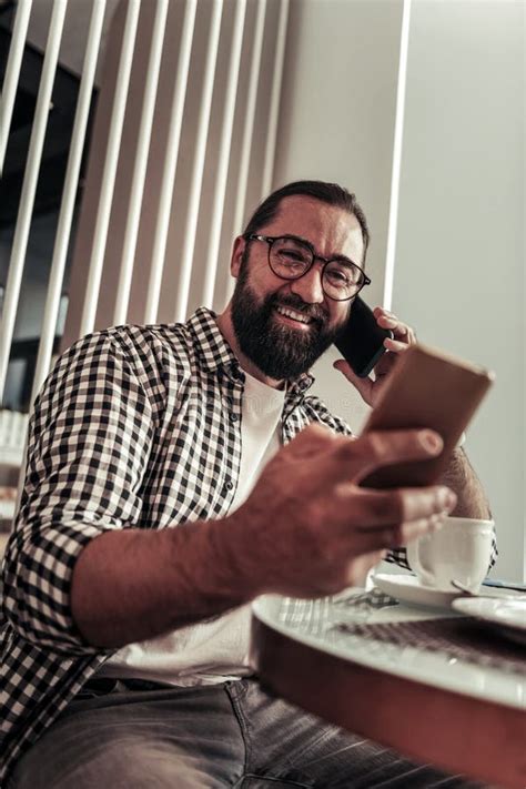 Happy Nice Bearded Man Looking at the Smartphone Screen Stock Image ...