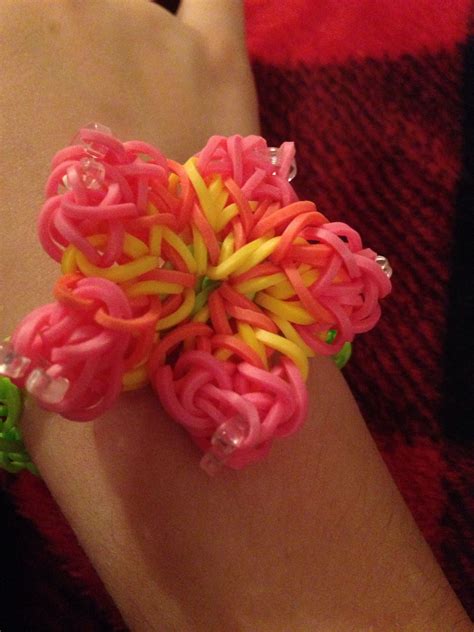 Cool rainbow loom flower I've made lots of them it is fun and easy you should try it. | Rainbow ...