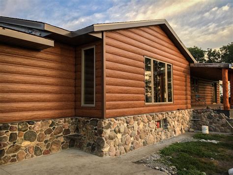 Rock bottom with Red Cedar Steel Log Siding. Great combination! | Log ...