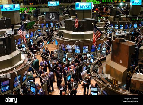 Stockbrokers busy on the trading floor of the New York Stock Exchange ...