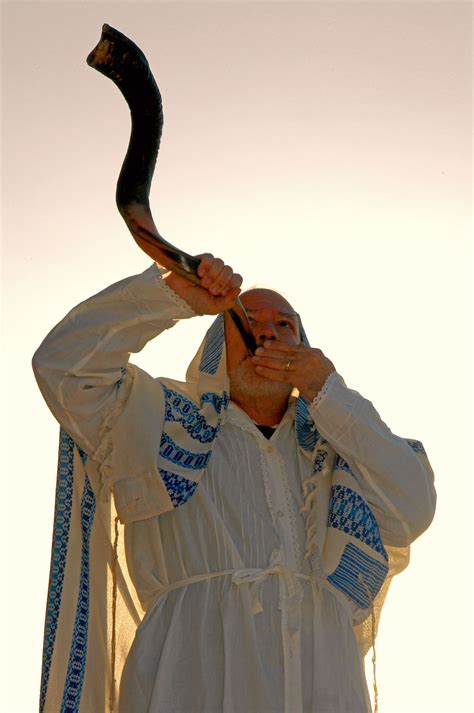 Sound the Alarm: an Israeli citizen blows the shofar (ram horn) at ...