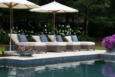 Kingsley-Bate Sag Harbor lounge chairs and umbrellas complete this residential pool deck. Shop ...