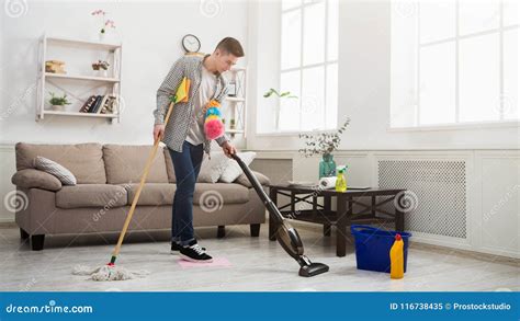 Young Man Cleaning House with Lots of Tools Stock Image - Image of cleaner, multitasking: 116738435